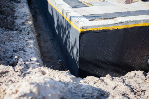 Professional Basement Waterproofing technician working in Ontario, OR